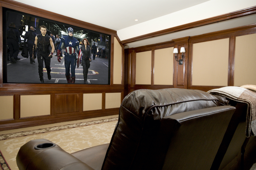 Home theater with Avengers movie playing on the large screen.
