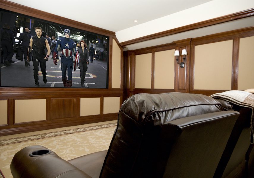 Home theater with Avengers movie playing on the large screen.